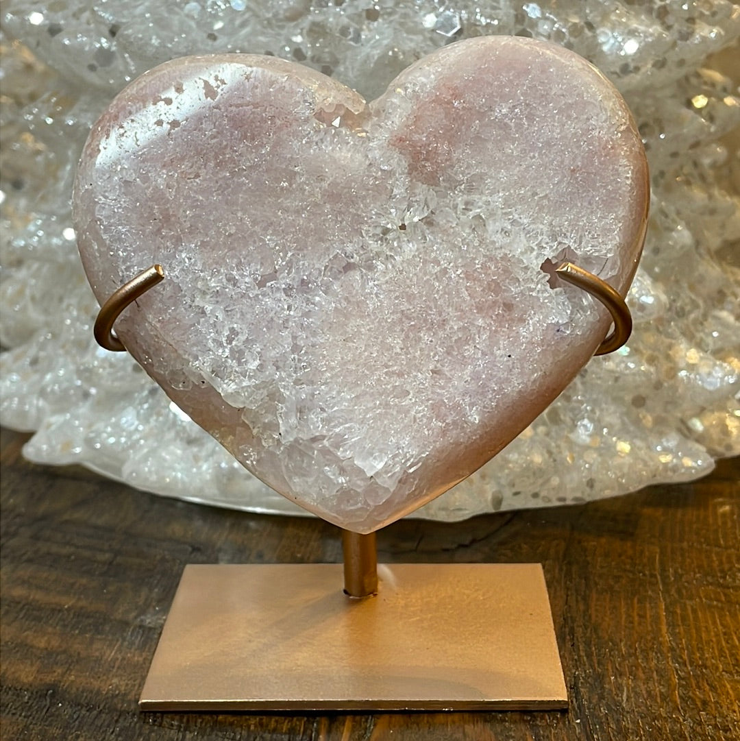 Pink Amethyst druzy hearts elagantly presented on custom metal stands, blending romance and sophistication in a crystalline showcase.