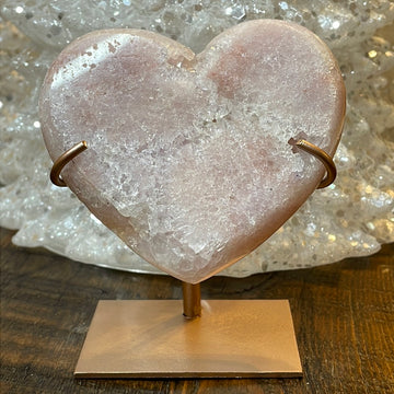 Pink Amethyst druzy hearts elagantly presented on custom metal stands, blending romance and sophistication in a crystalline showcase.