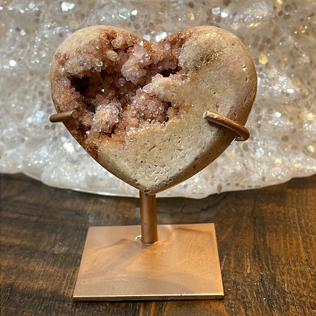 Pink Amethyst druzy hearts elagantly presented on custom metal stands, blending romance and sophistication in a crystalline showcase.