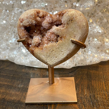 Pink Amethyst druzy hearts elagantly presented on custom metal stands, blending romance and sophistication in a crystalline showcase.