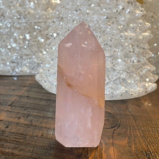 Elegant Rose Quartz tower, featuring soft pink tones with golden healer and a graceful crystal formation for a serene and enchanting aesthetic