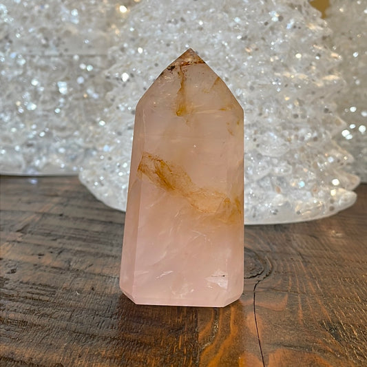 Elegant Rose Quartz tower, featuring soft pink tones, with golden healer and a graceful crystal formation for a serene and enchanting aesthetic
