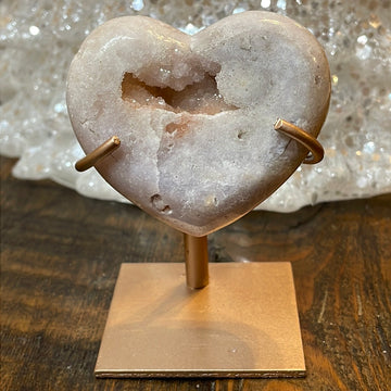 Pink Amethyst druzy hearts elagantly presented on custom metal stands, blending romance and sophistication in a crystalline showcase.