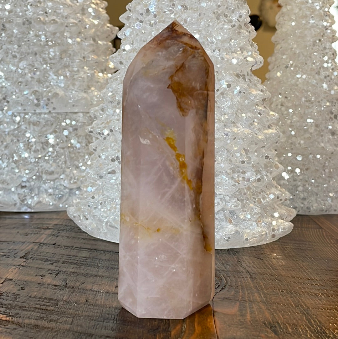 Elegant Rose Quartz tower, featuring soft pink tones with golden healer and a graceful crystal formation for a serene and enchanting aesthetic