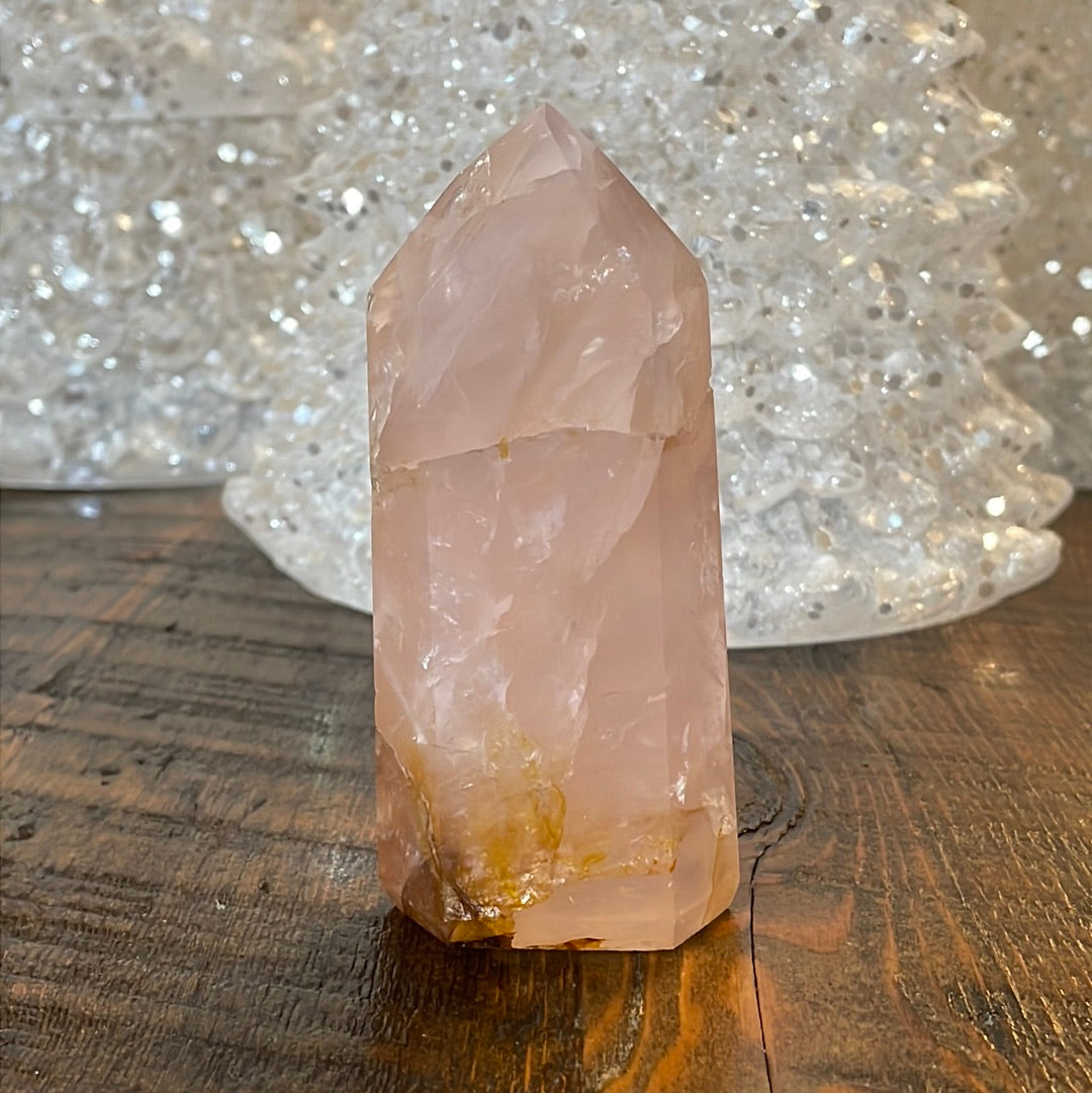 Elegant Rose Quartz tower, featuring soft pink tones with golden healer and a graceful crystal formation for a serene and enchanting aesthetic