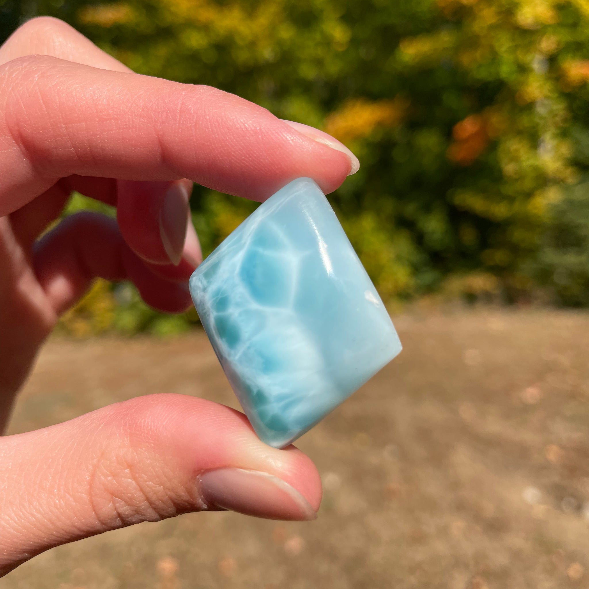 Light blue with soft white lines, Diamond in shape, with polished surface. It has effects on four of the seven Chakras.
