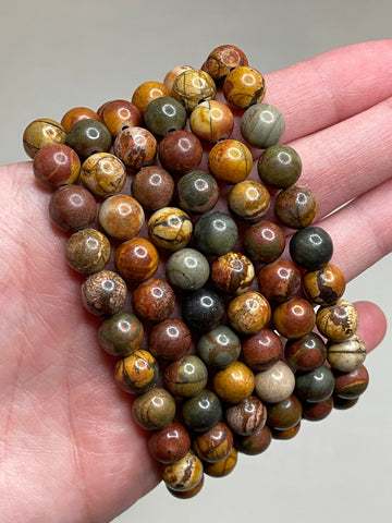 Picasso Jasper bracelet featuring 8mm beads, showcasing the distinctive and artistic patterns resembling a painter's palette in the Jasper stone. This bracelet combines natural beauty with a touch of creative flair , making it a stylish and unique accessory for various occasions. 