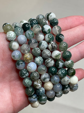 Tree Agate bracelet with 8mm beads, featuring the calming and earthly tones of tree agate crystals. The bracelet combines natural beauty with a sense of grounding, making it a stylish and soothing accessory.