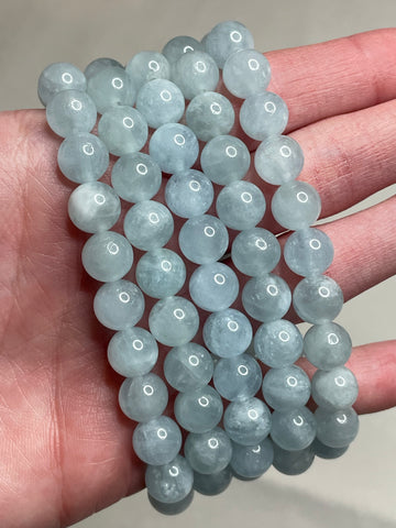 Aquamarine bracelet with 8mm beads, featuring the serene blue tones of Aquamarine gemstones. This bracelet combines elegance and a soothing aesthetic, making it a charming accessory for a touch of tranquility in any ensemble.