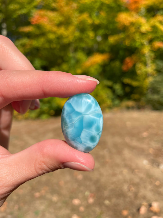 Light blue with soft white lines, oval in shape with polished surface. It has effects on four of the seven Chakras