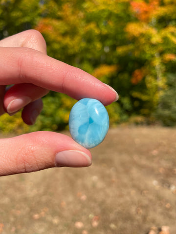 Light blue with soft white lines, round in shape with polished surface. It has effects on four of the seven Chakras