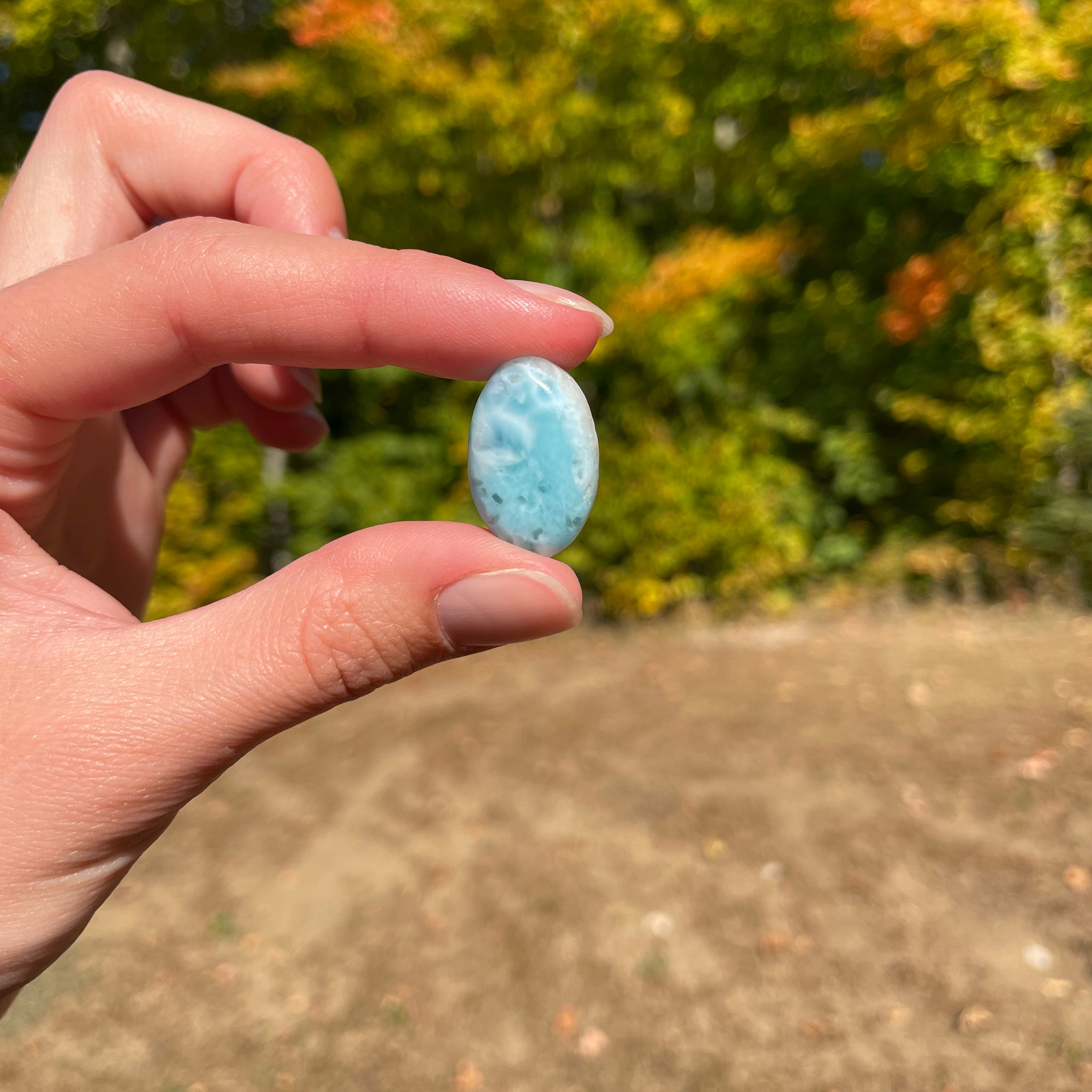 Light blue with soft white lines, Oval in shape with polished surface. It has effects on four of the seven Chakras