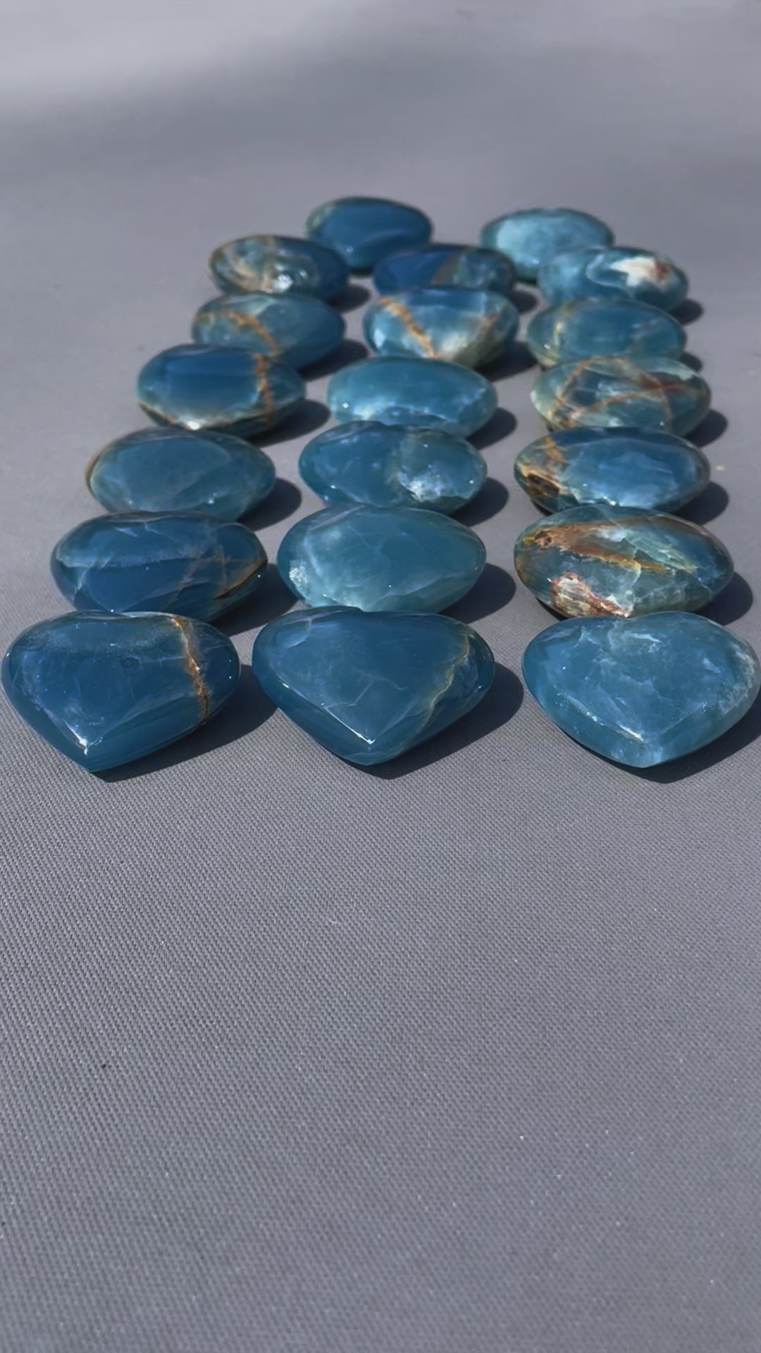 In this video, Lemurian Calcite gemstones - hearts, moons, frogs - smooth, pastel hues