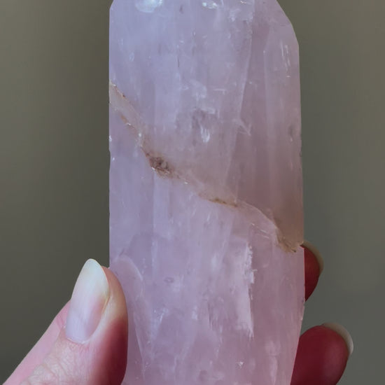 Elegant Rose Quartz tower, featuring soft pink tones with golden healer and a graceful crystal formation for a serene and enchanting aesthetic