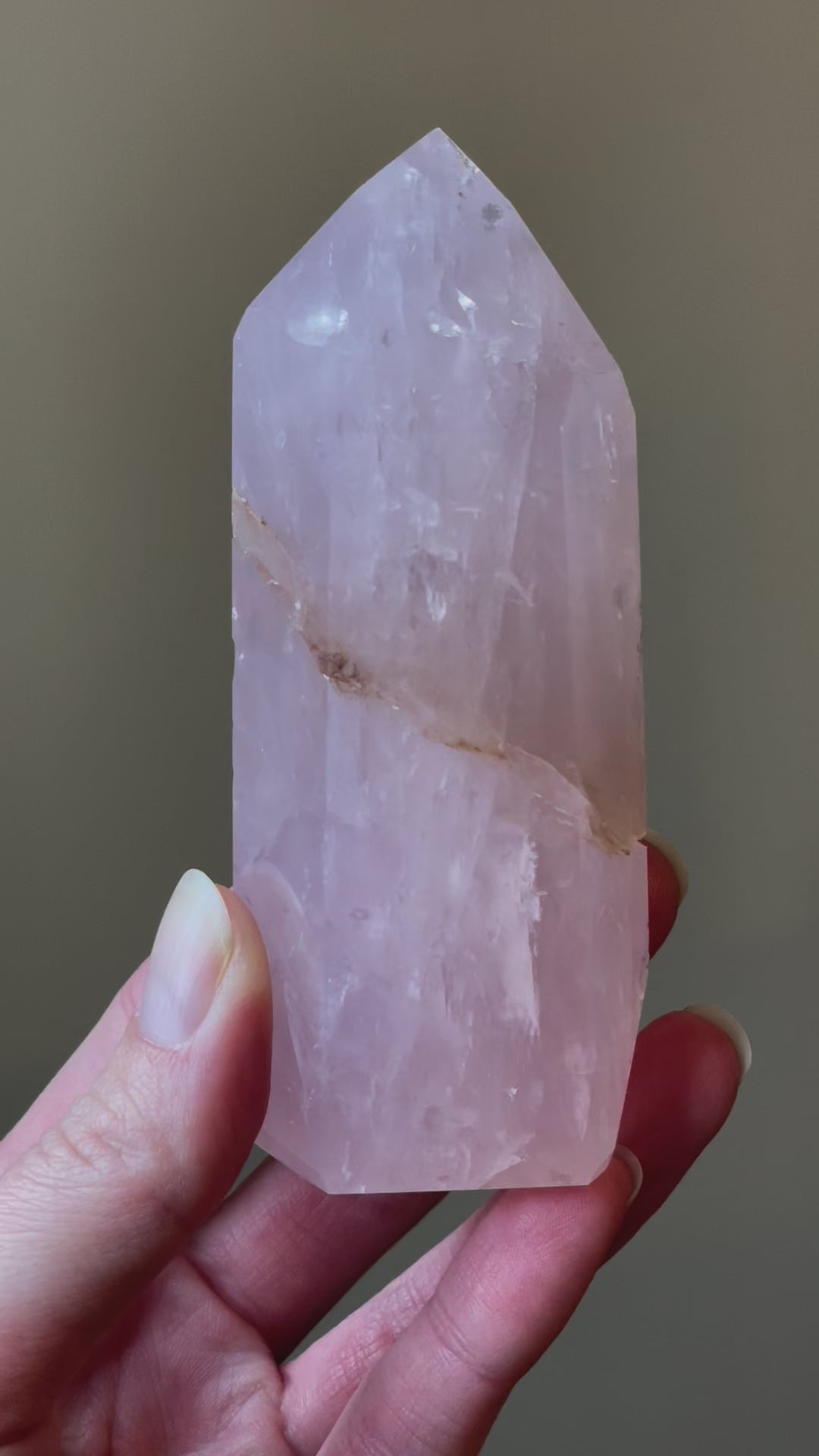 Elegant Rose Quartz tower, featuring soft pink tones with golden healer and a graceful crystal formation for a serene and enchanting aesthetic