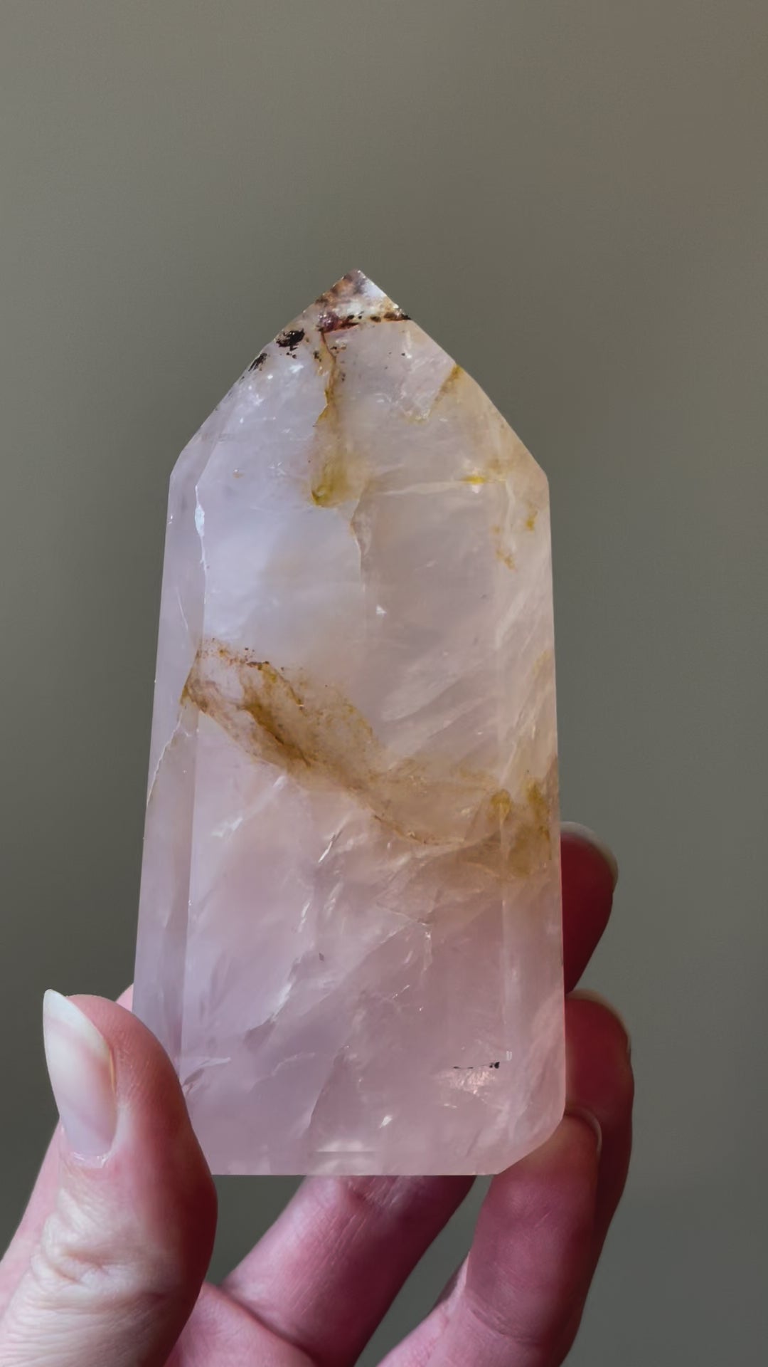 In this video, Elegant Rose Quartz tower, featuring soft pink tones, with golden healer and a graceful crystal formation for a serene and enchanting aesthetic