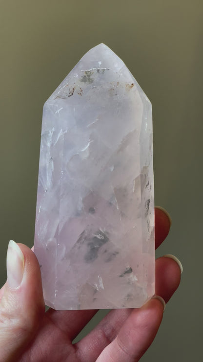 In this video, Elegant Rose Quartz tower, featuring soft pink tones and a graceful crystal formation for a serene and enchanting aesthetic